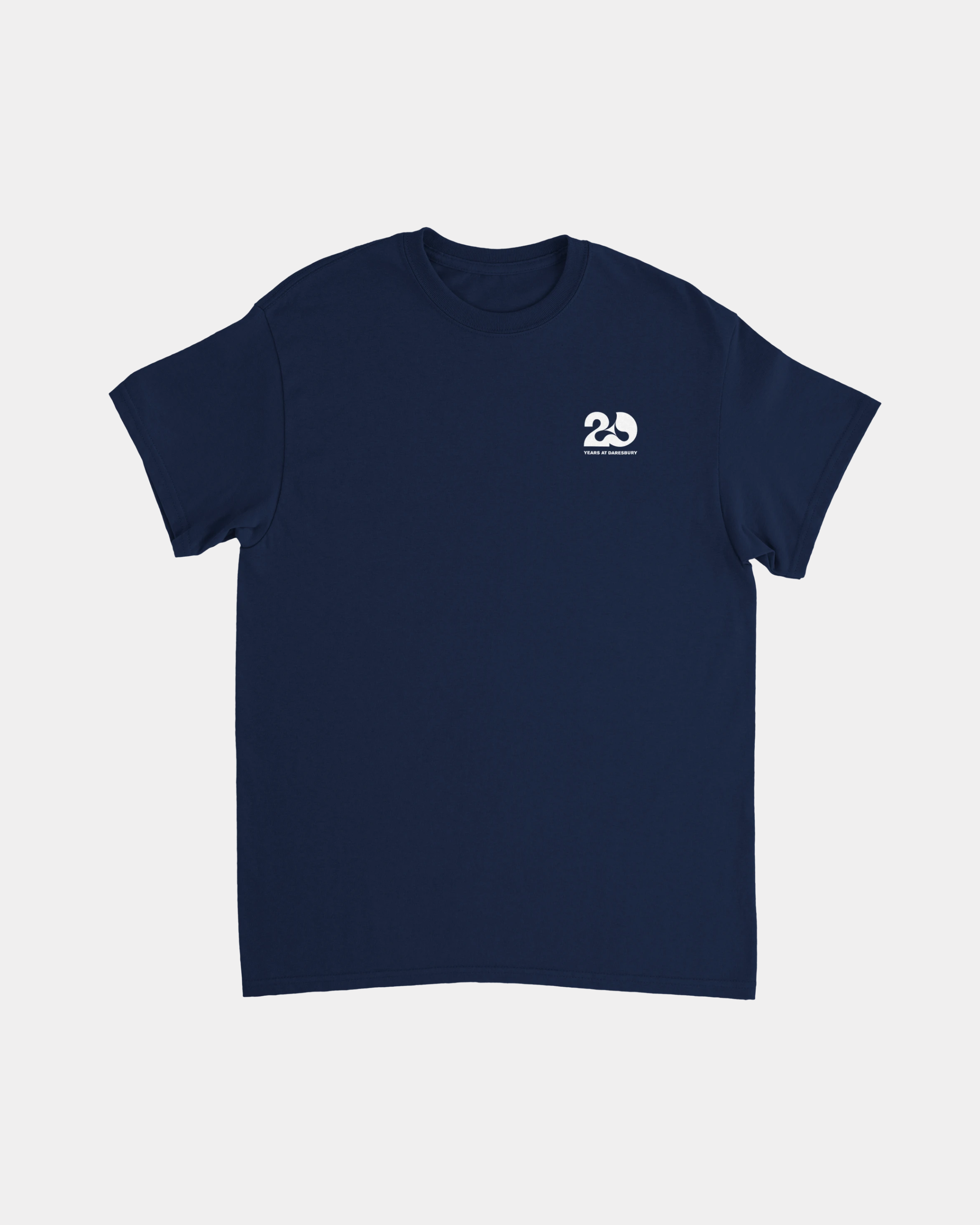 The Creamfields 2026 Line-Up 20 Years Navy T Shirt features a classic fit and is crafted from heavyweight cotton. This short-sleeve shirt comes in navy blue with a small white 2D logo and text on the left chest, making it a durable staple for any wardrobe. The shirt is shown flat against a plain white background.