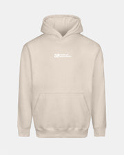 Creamfields 2026 Click & Collect 20th Anniversary Hoodie in beige with a front pocket and small white "25 Years at Daresbury" text on the chest. Displayed against a plain light background.