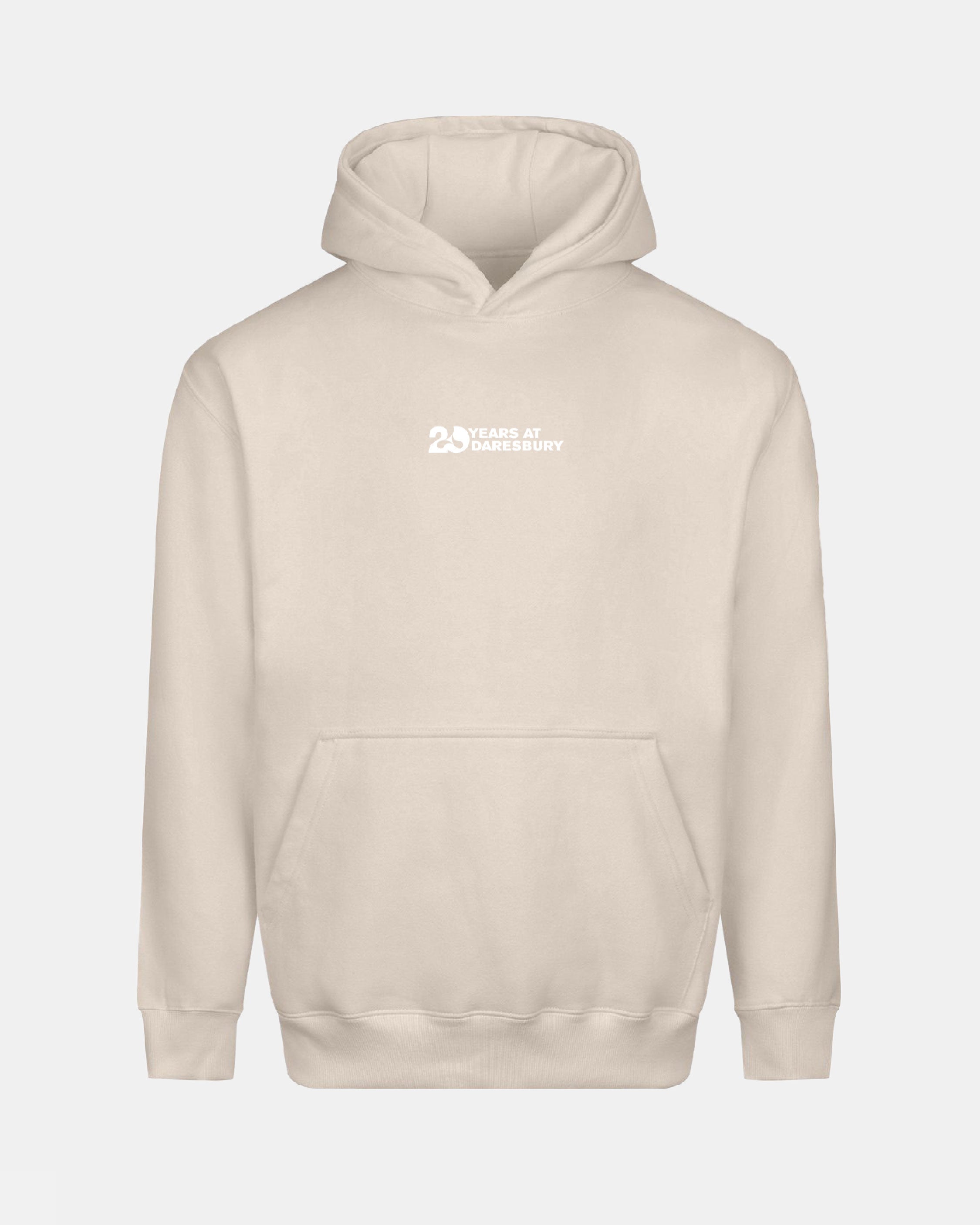 Creamfields 2026 Click & Collect 20th Anniversary Hoodie in beige with a front pocket and small white "25 Years at Daresbury" text on the chest. Displayed against a plain light background.