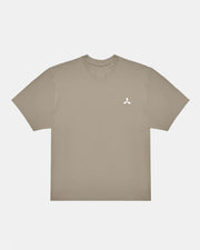 Creamfields 2026 Click & Collect Creamfields Metal T-Shirt in beige with short sleeves, featuring a small white abstract logo on the left chest, displayed flat on a plain white background.
