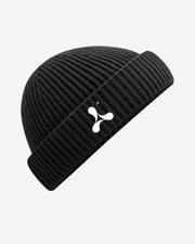 The Creamfields 2025 Fishermans Beanie by Creamfields is a black ribbed knit hat with a folded cuff and a white abstract logo on the front, displayed against a light gray background.
