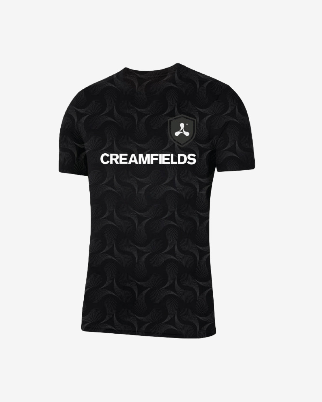 The Creamfields 2025 Football T-Shirt is a black tee with a subtle swirl design, a bold white CREAMFIELDS logo on the chest, and an abstract symbol patch on the left side.