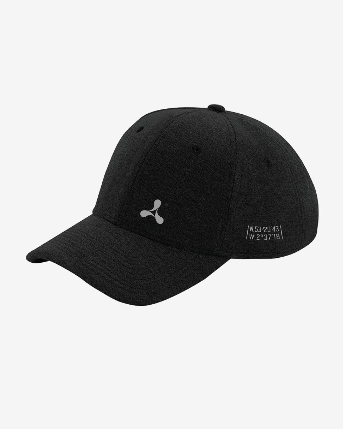 The Creamfields 2025 Jersey Baseball Cap Black features a curved brim, a small gray logo on the front, and white coordinates N.52°2043 W.2°3718 printed on the side above the brim.