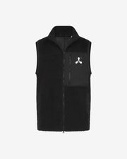 The Creamfields 2025 Recycled Sherpa Gilet by Creamfields is a black sleeveless fleece vest with a front zipper, a left zip chest pocket, and a small white abstract logo above the pocket, shown on a plain white background.